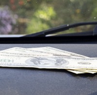 money on car dashboard