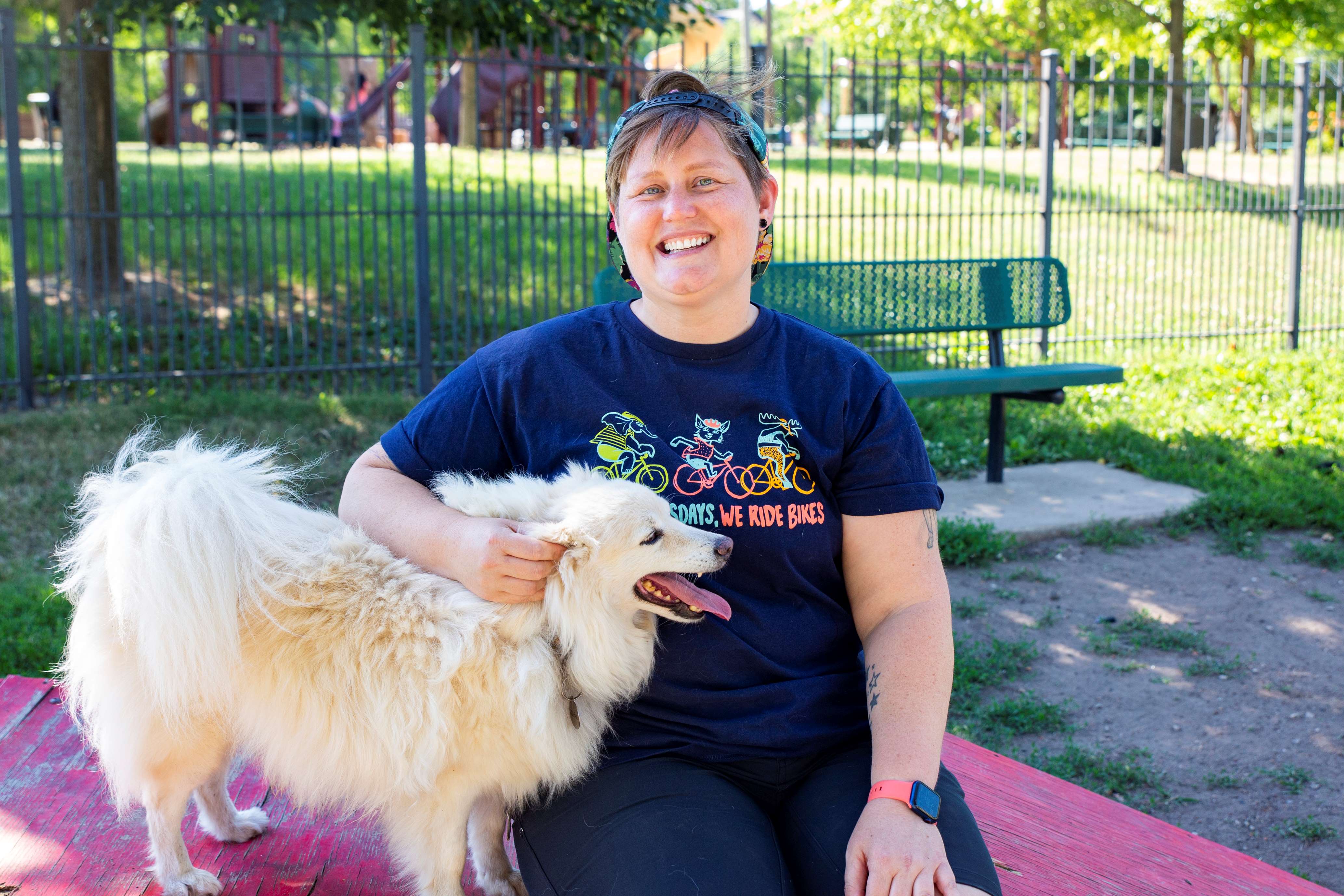 lady with a fluffy dog at a park